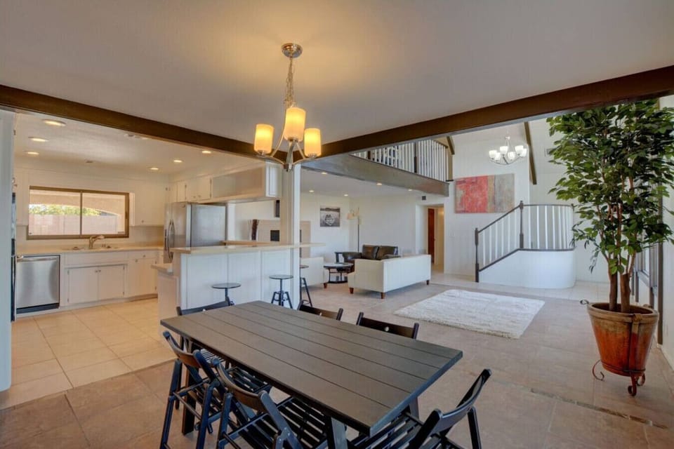 Gourmet kitchen with stainless appliances and dining table