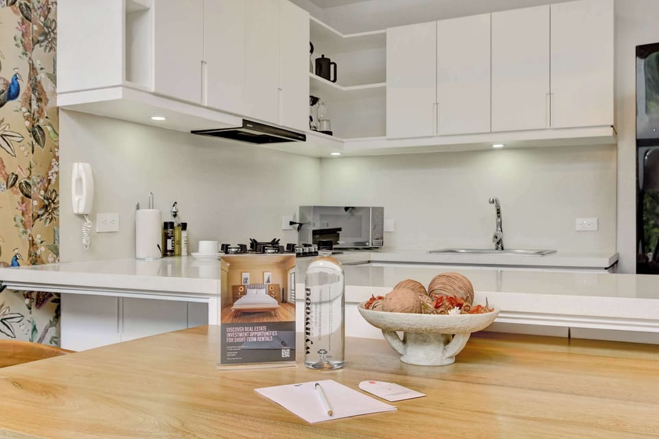 Bright kitchen with ample counter space and storage.