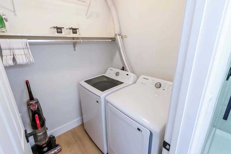 Laundry Room w washer, dryer, Iron and Vacuum