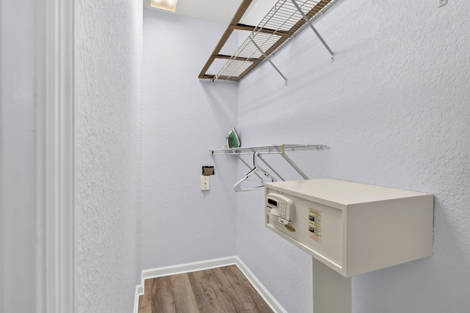 Your walk-in closet offers organized storage with built-in shelving, hanging rods, and a convenient in-room safe to keep your valuables secure during your stay.