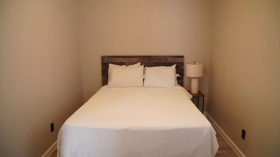 Drift off in a simple, cozy bedroom after adventures.