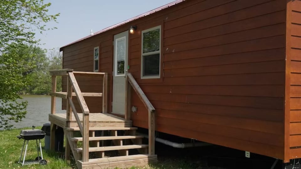 Arrive to a charming cabin with easy lakeside access.