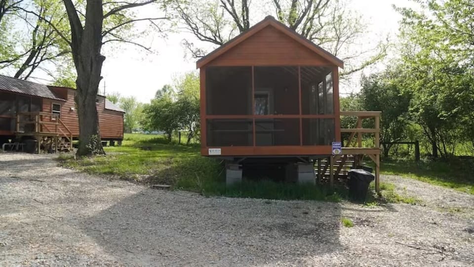 Arrive to your private cabin retreat nestled in trees.