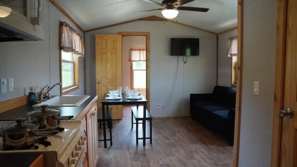 Cook with ease in a bright kitchen beside comfy seating.