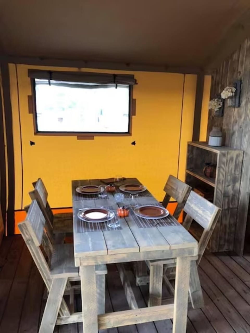 Serve and share a relaxed meal in warm, cabin-style comfort.