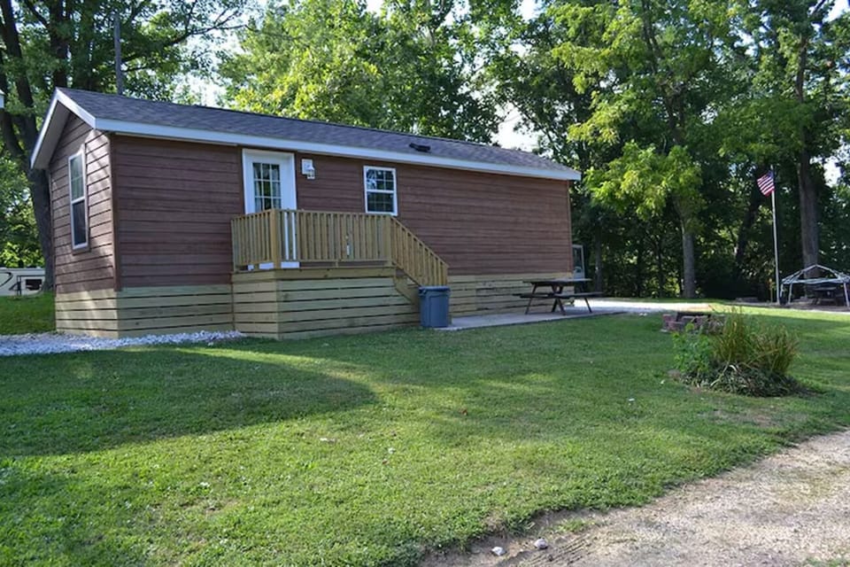 Enjoy lazy afternoons outside with open lawn and picnic table.