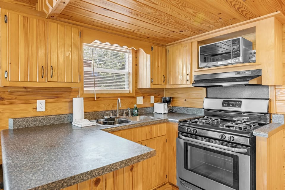 Cook hearty meals in a fully equipped, cabin kitchen.