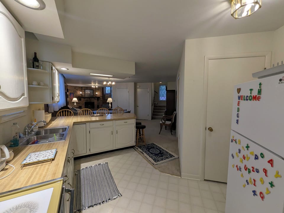 2nd. floor kitchen view towards front room and third floor stairs.
