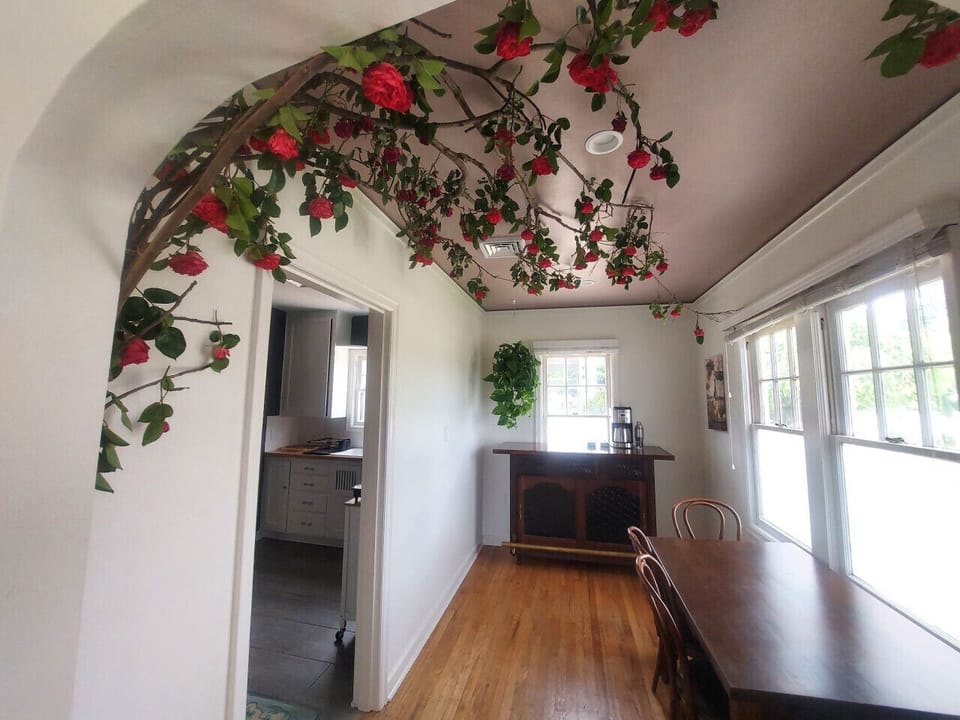 Dining nook with dried rose art work