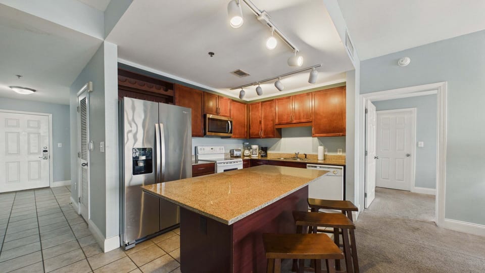 Full kitchen with island and breakfast seating and all the cooking essentials