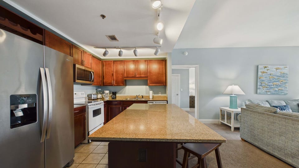 Full kitchen with island and breakfast seating and all the cooking essentials