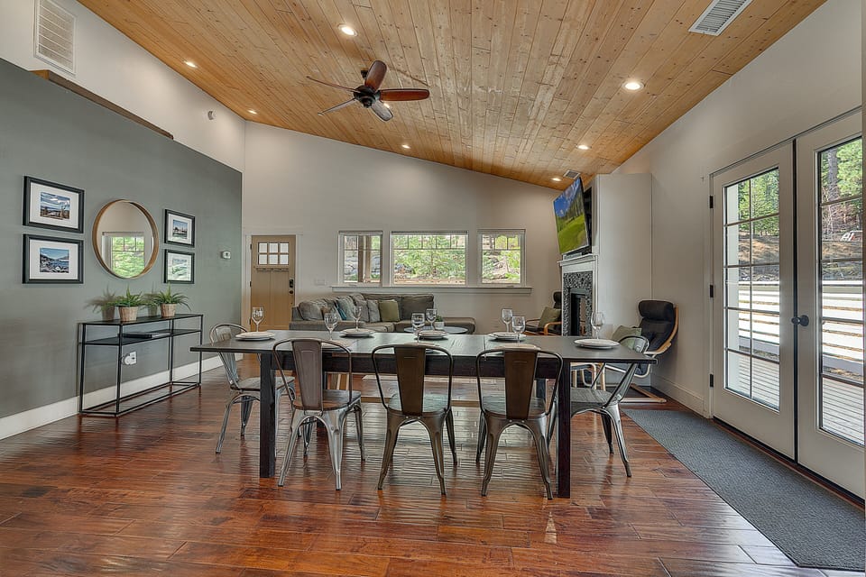 Warm dining space beneath vaulted wood ceilings, perfect for shared meals & easy conversation