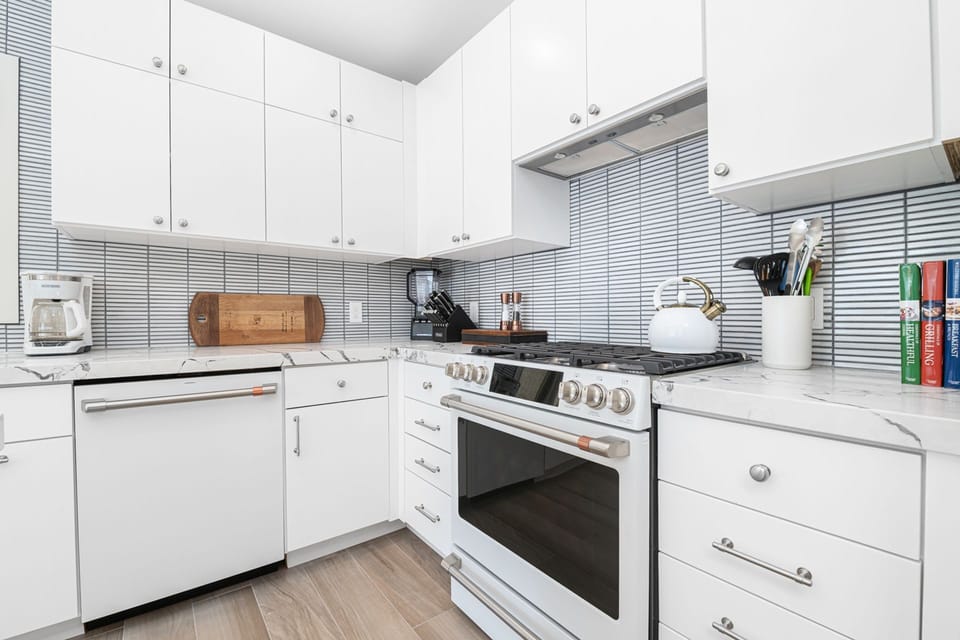 Bright and functional kitchen layout with ample counter space and everything needed for easy meal prep.
                
