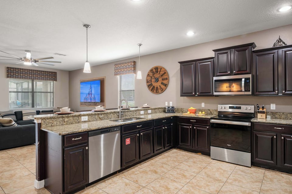 Large open kitchen w/ island seating & plenty of counter space for meals together