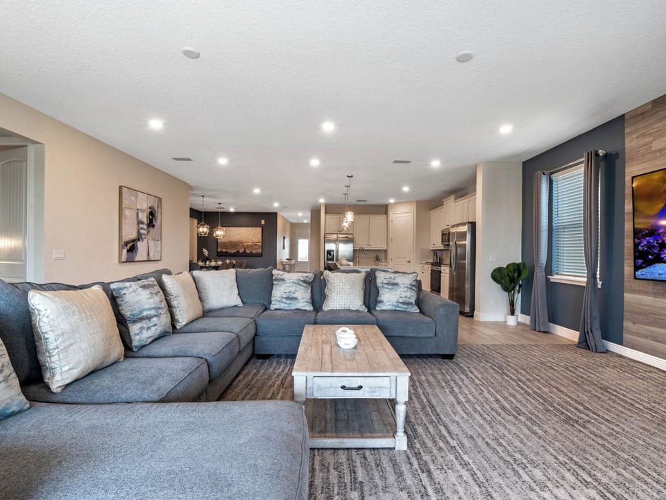 Open-concept living space w/ cozy sectional seating & plenty of room to spread out