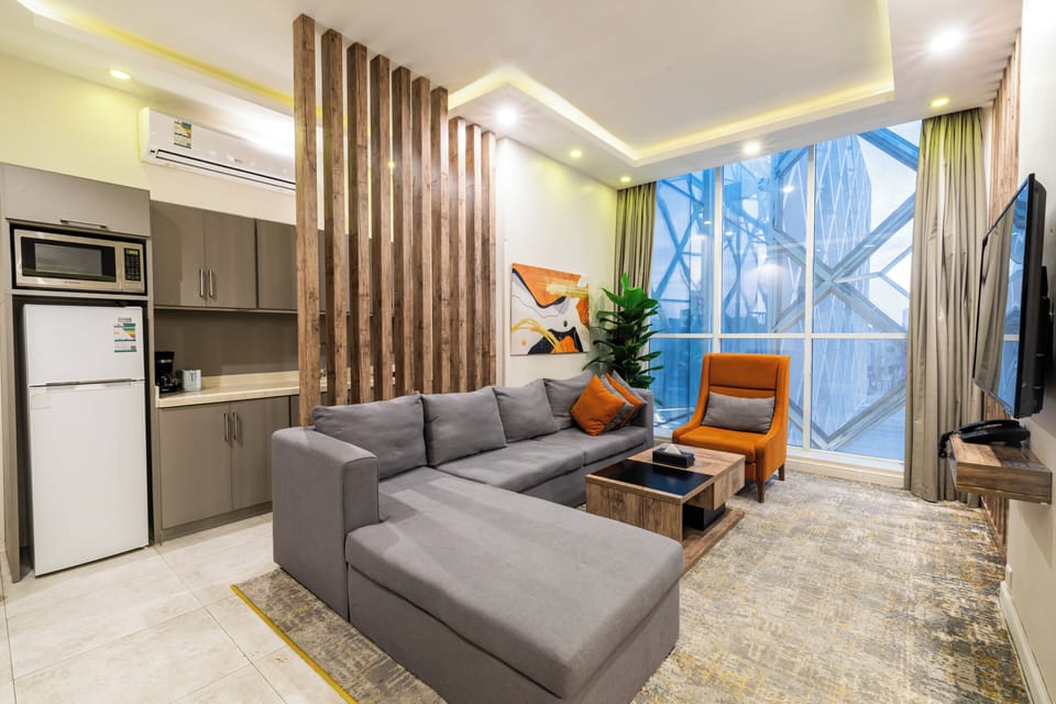 Apartment, 2 Bedrooms | Living area | 50-inch LCD TV with cable channels