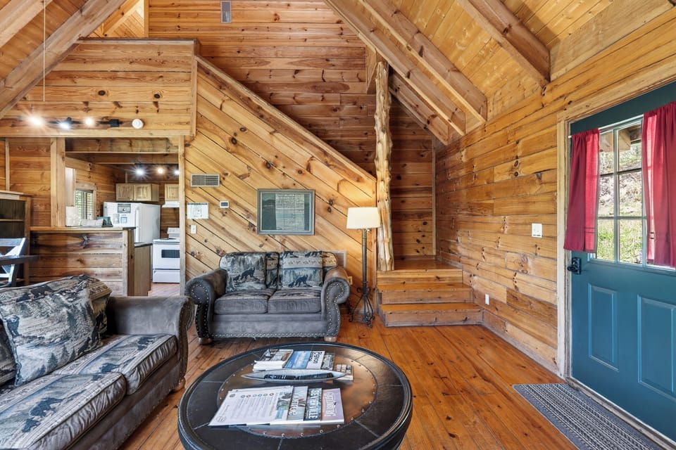 Cozy living area with a fireplace and TV—perfect for relaxing nights in after exploring the Smokies.