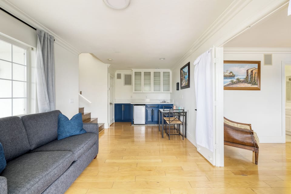 Additional lounge space on the lower level features a couch and a kitchenette. (Main House)