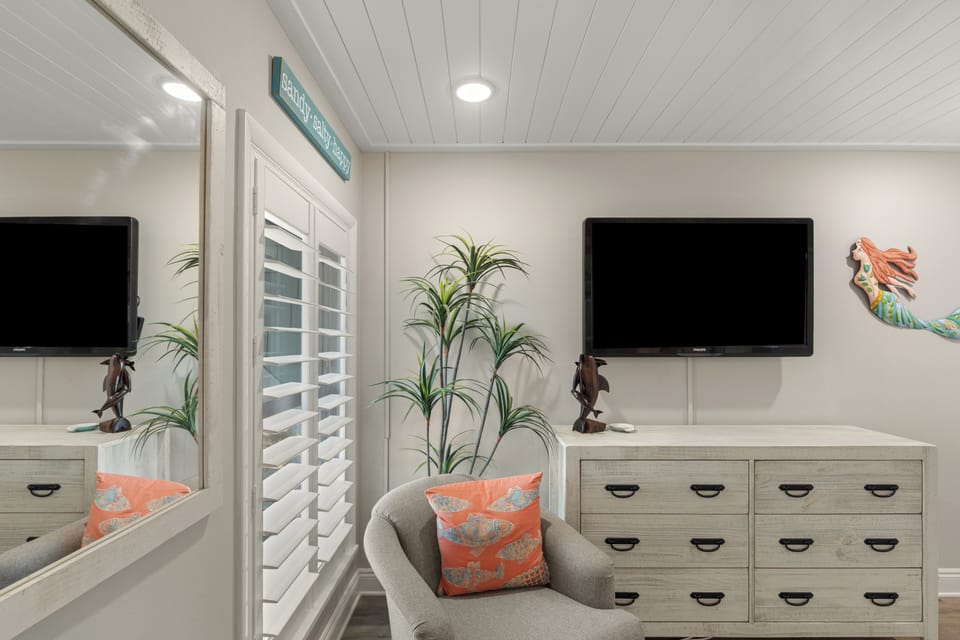 Private seating area in the bedroom with a tropical touch.