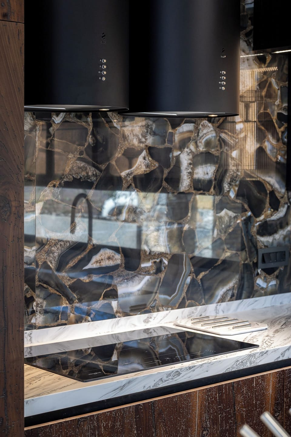 Fully equipped kitchen finished in VENETIAN wood, CORIAN counter, featuring modern appliances and a wine fridge