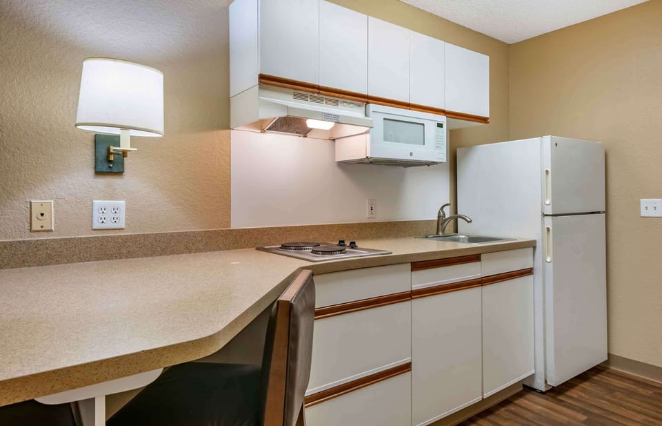 Studio, 1 Queen Bed, Non Smoking | Private kitchen | Fridge, microwave, stovetop, coffee/tea maker