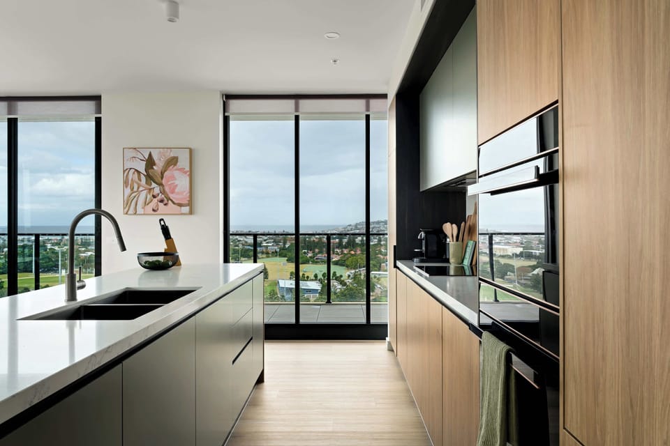 Modern, fully equipped kitchen with island seating-designed for everyday ease/entertaining. Featuring pod coffee machine, double-door fridge/freezer, sandwich press, blender, plus all the essentials you need to cook, gather & enjoy meals w loved ones