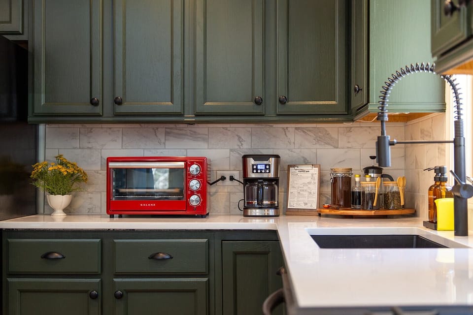 A bright, fully equipped kitchen with ample counter space for cooking and gathering.