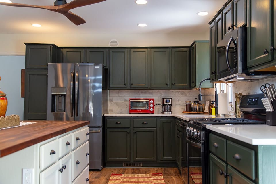 A bright, fully equipped kitchen with ample counter space for cooking and gathering.