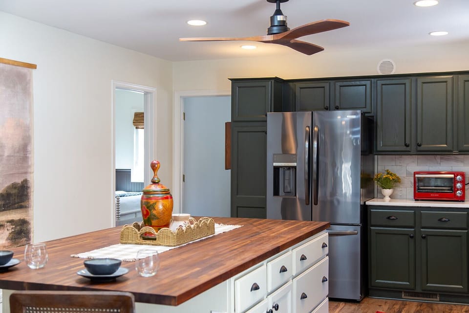 A bright, fully equipped kitchen with ample counter space for cooking and gathering.