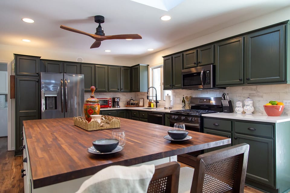 A bright, fully equipped kitchen with ample counter space for cooking and gathering.