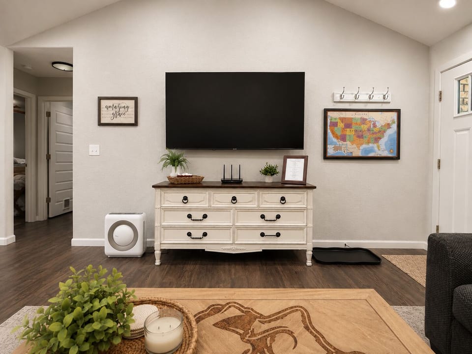 Living room featuring a 75" Smart TV and our guest map - be sure to add a pin to show us where you're visiting from! 