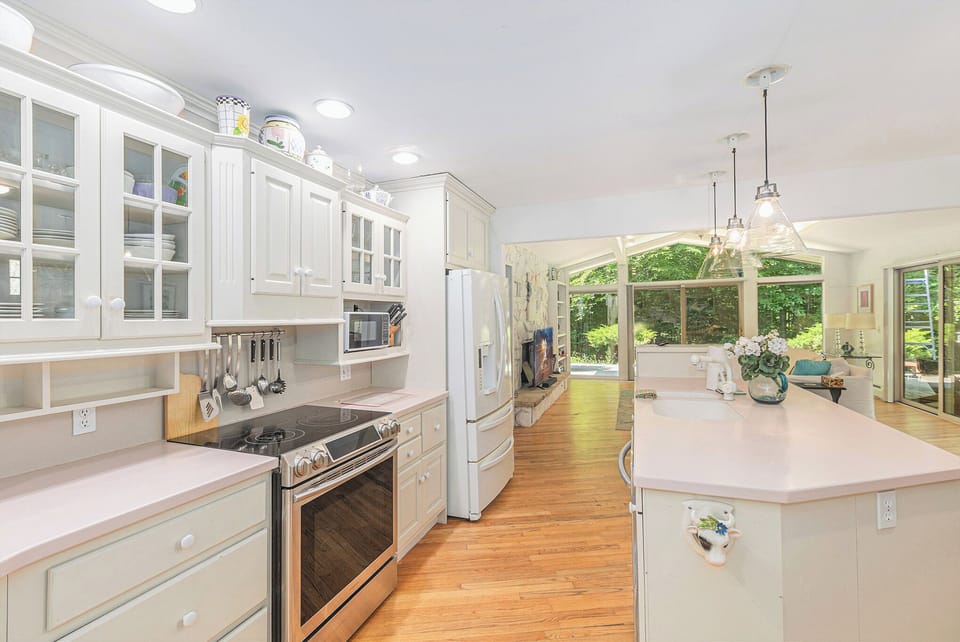 KITCHEN:  The large kitchen with all appliances and a good supply of cooking and dining utensils.