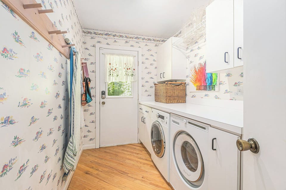LAUNDRY ROOM:  The home has a large laundry room with a front load washer and dryer.
