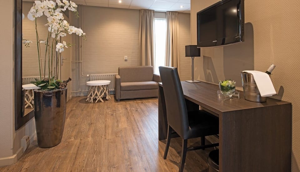 Stroll past elegant florals into a calm, cozy seating nook.