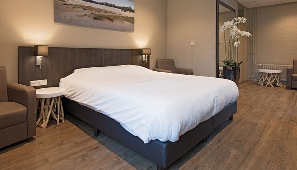 Unwind on plush bedding in a warm, calming retreat