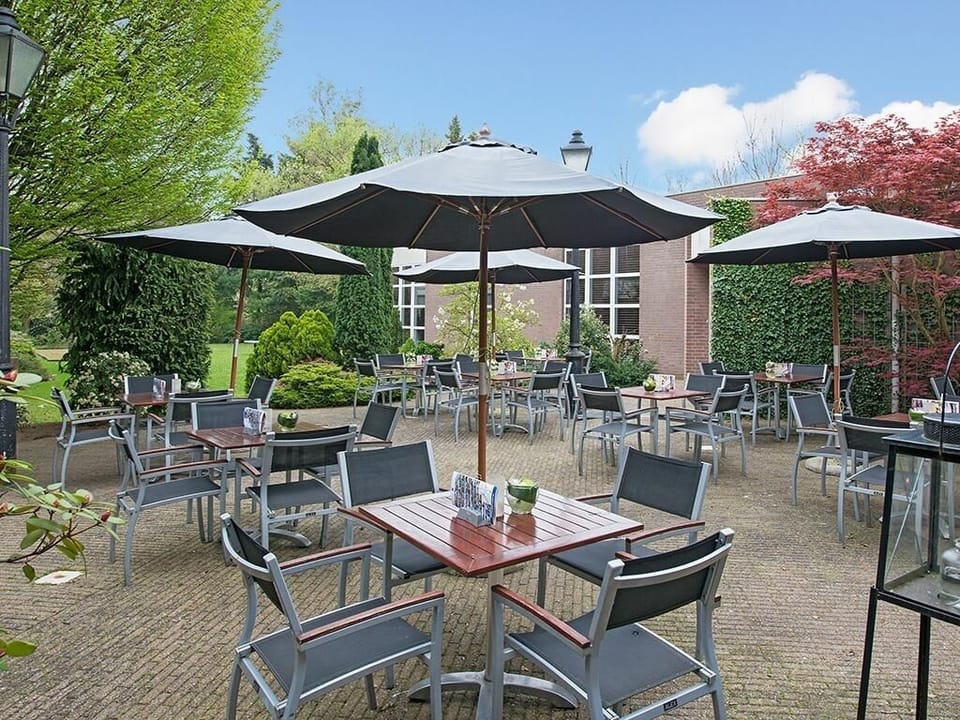Breathe deeply in the leafy courtyard with shaded seating.