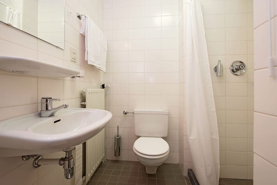 Start your day refreshed with bright shower and tidy vanity