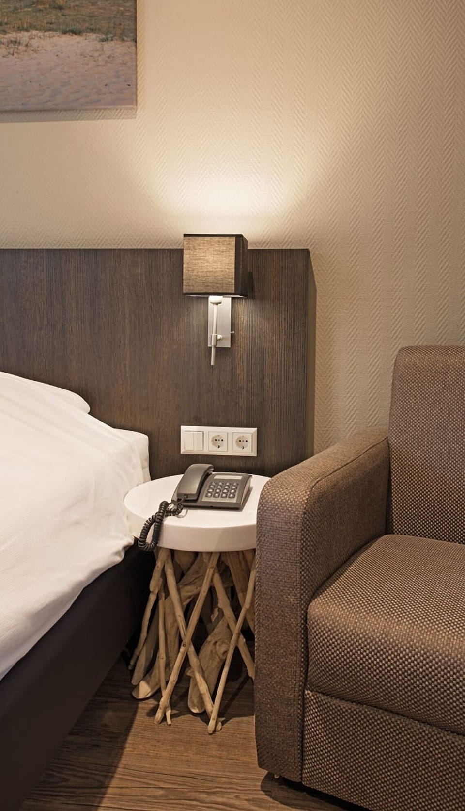 Enjoy thoughtful bedside details with lighting, outlets, and easy comfort.