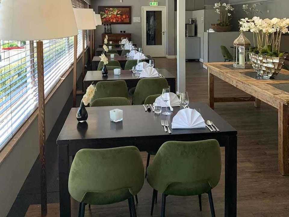 Enjoy an intimate table setting with crisp linens and calm light.