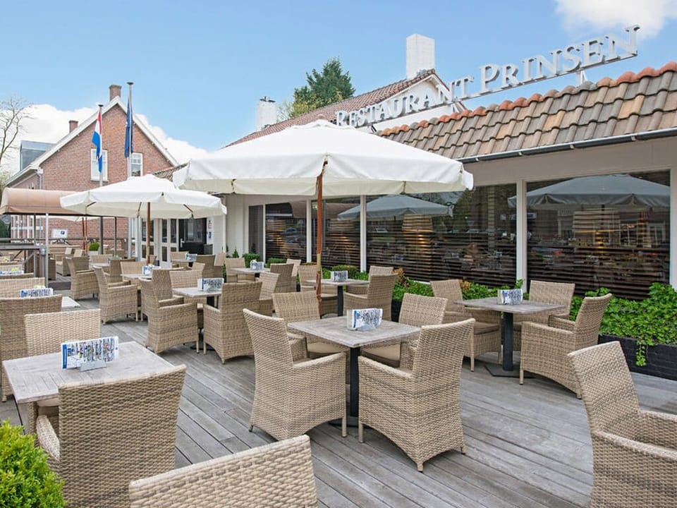 Arrive to a welcoming exterior with an inviting terrace.
