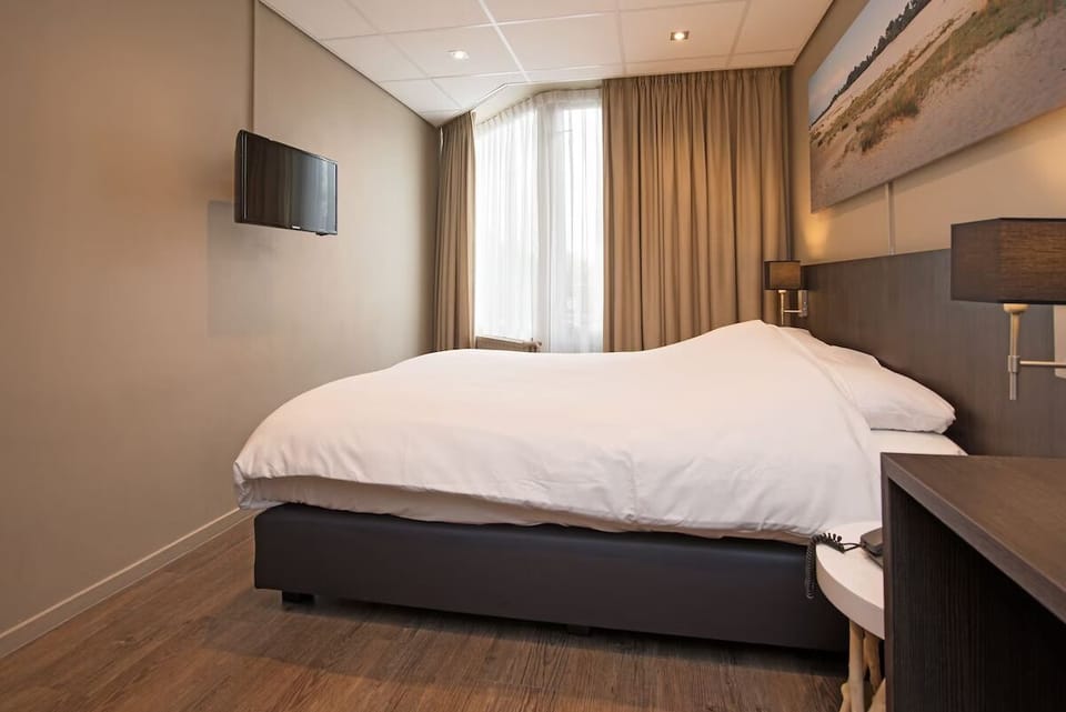 Settle in for a restful night with TV and soft daylight.