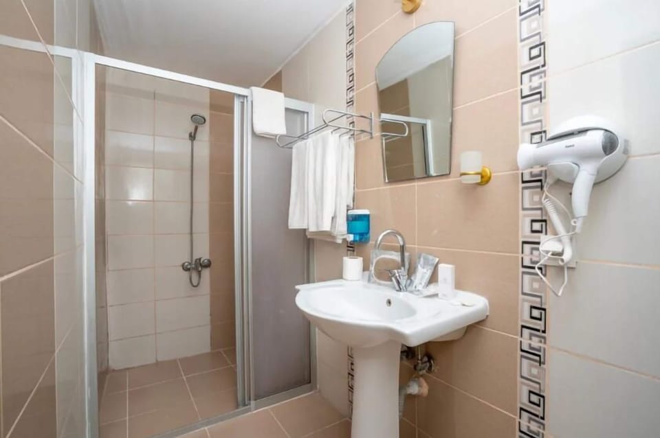 Hair dryer, towels, soap, shampoo