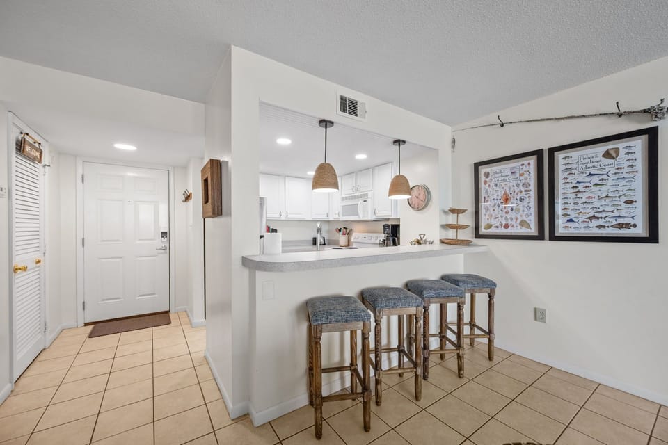 Breakfast bar with seating for four, perfect for casual meals and morning coffee