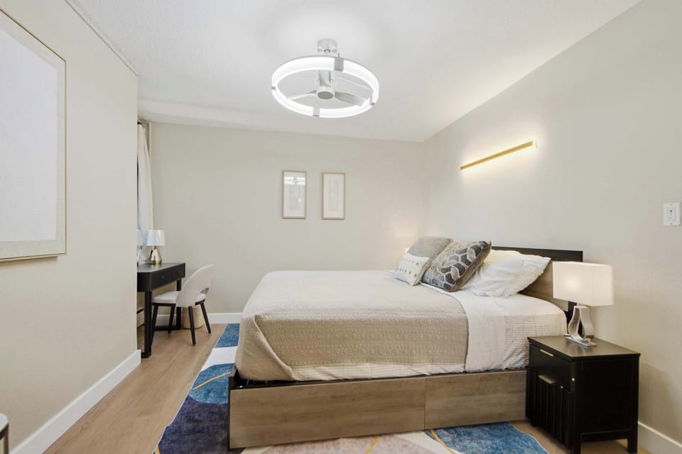 Wake up to soft natural light in a calm, cozy bedroom designed for restful nights.