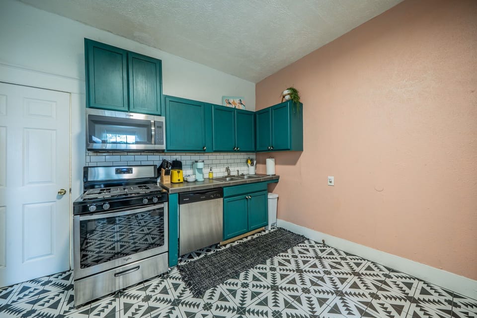 Cook in style with vibrant decor and high-end stainless appliances.
