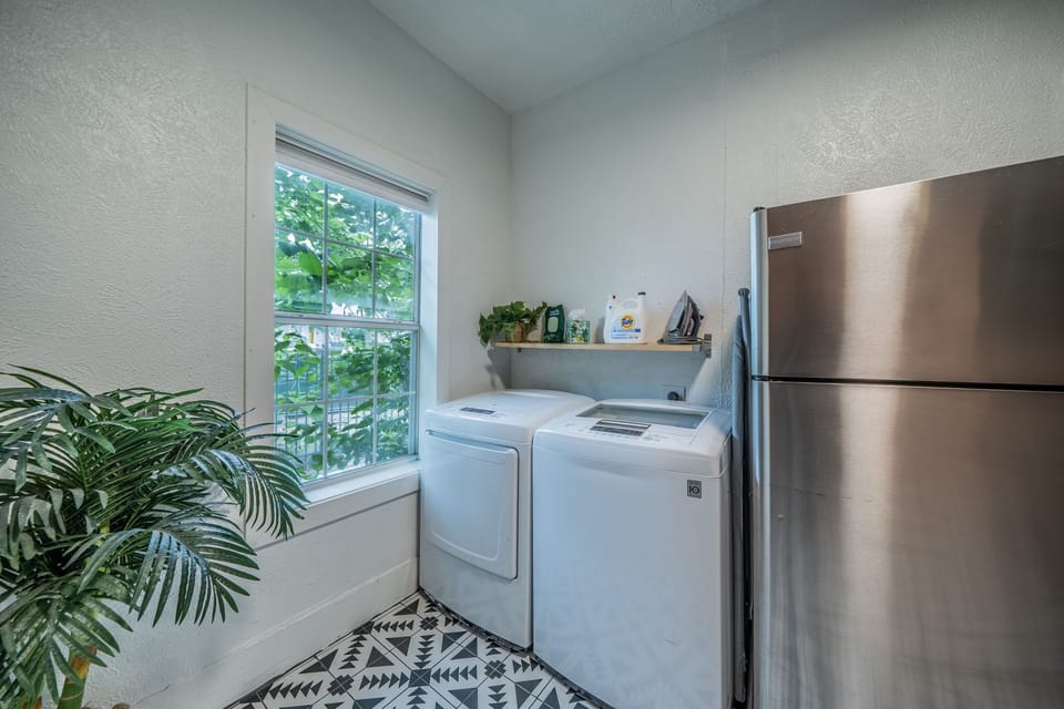 Convenient in-unit laundry area right next to the kitchen.
