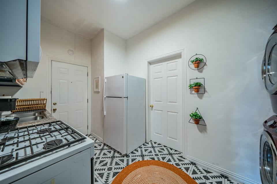 Convenience at your fingertips with a stacked in-unit washer and dryer.
