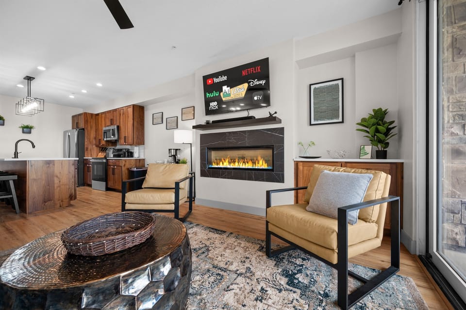 Gather around the sleek fireplace and enjoy movie nights on the large smart TV with elevated comfort.