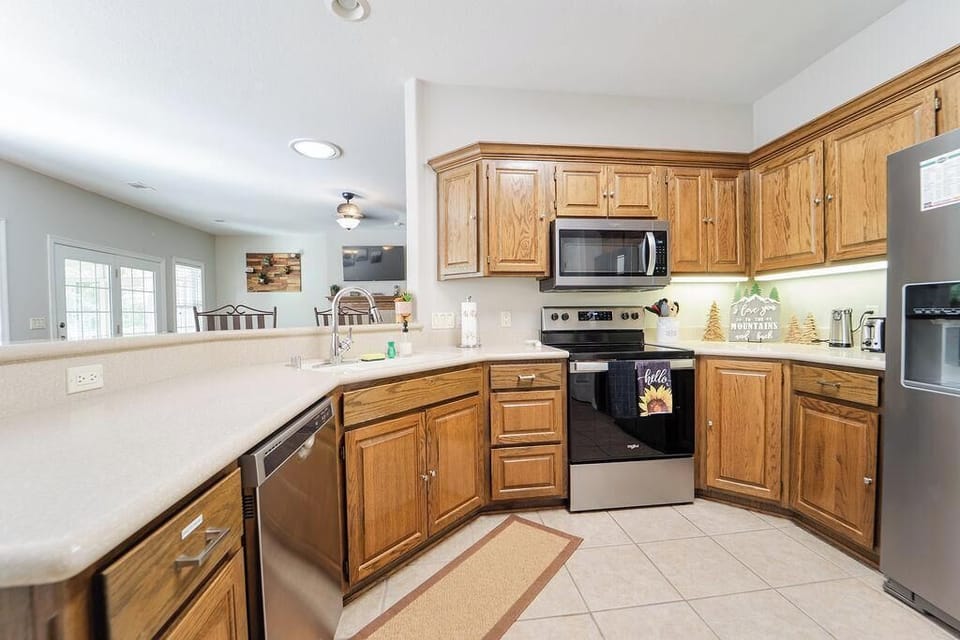 Stocked kitchen with stainless steel appliances 