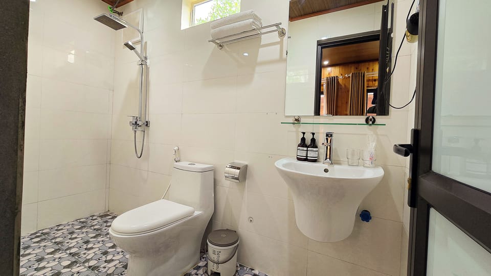 Shower, free toiletries, hair dryer, slippers
